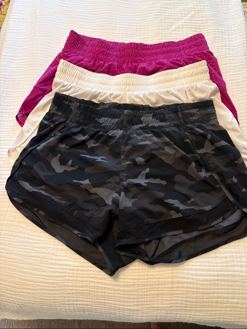 Athleta 3-Pack Performance Shorts - Black Camo, White, Magenta. Mesh racer run.